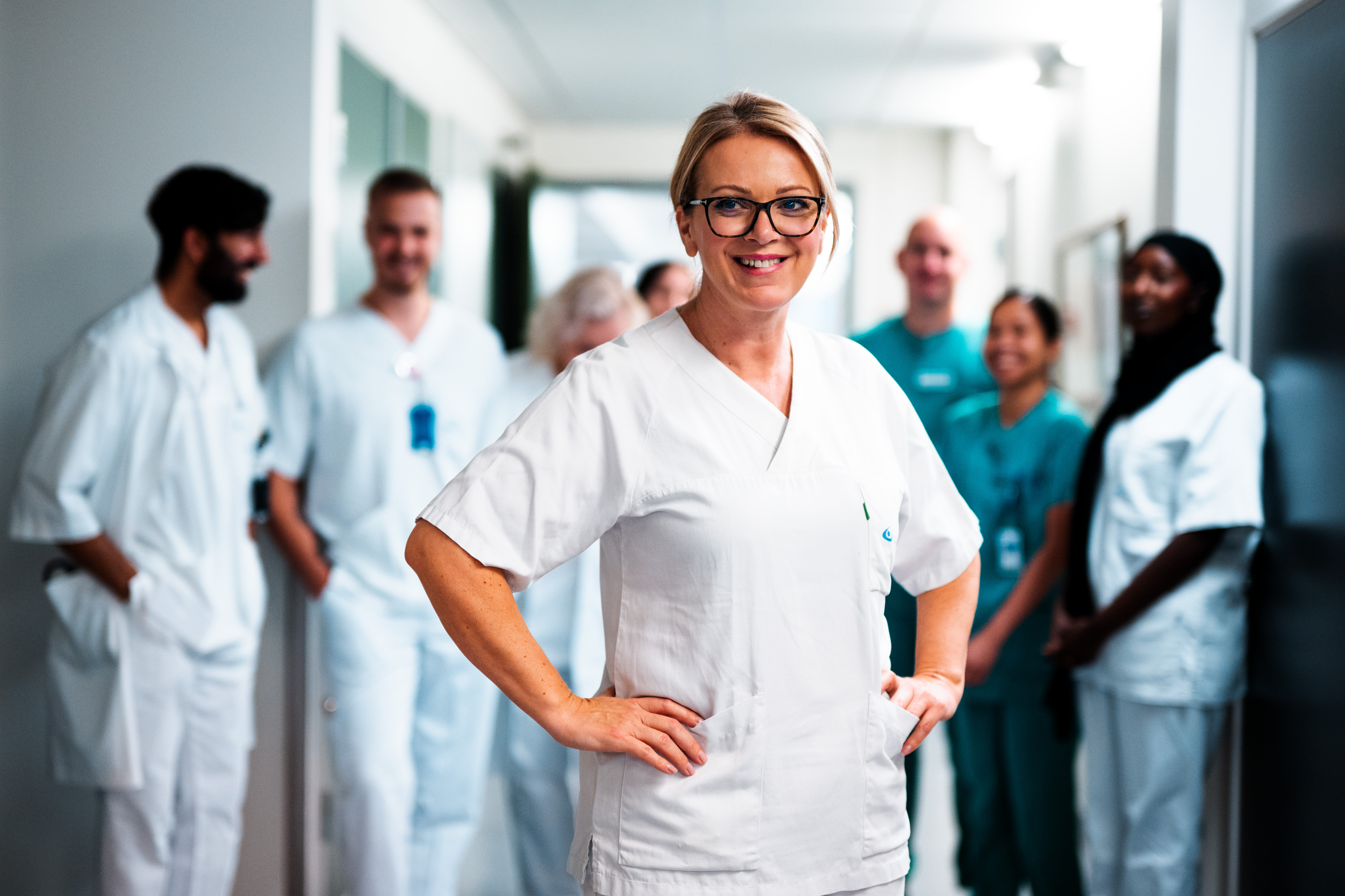 A group of people in white lab coats