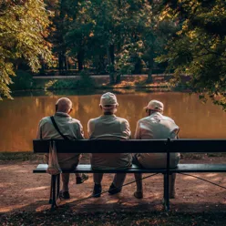A group of old men sitting on a bench